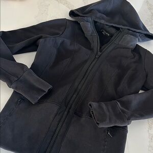 Athleta Warm & Stylish athletic Black Zip-Up Jacket with ribbed waistline.
